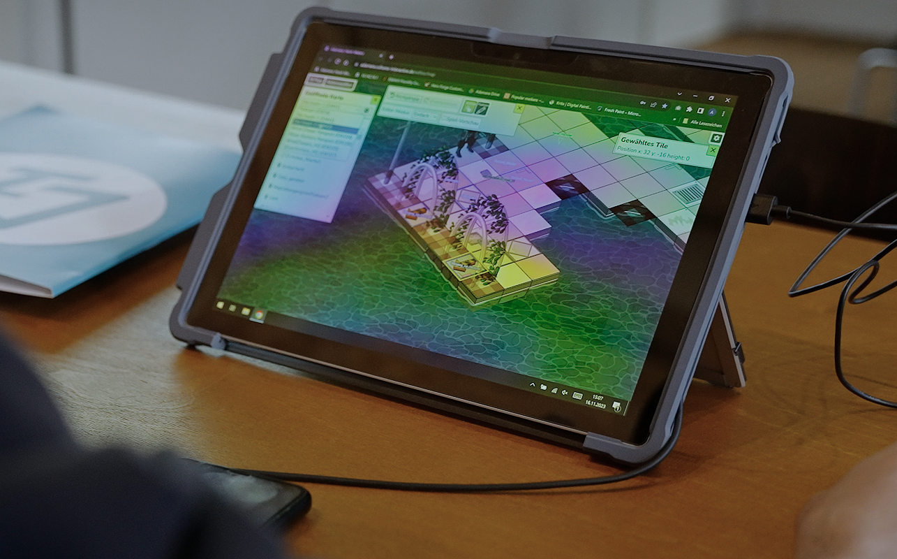 Person playing Adamara on a tablet