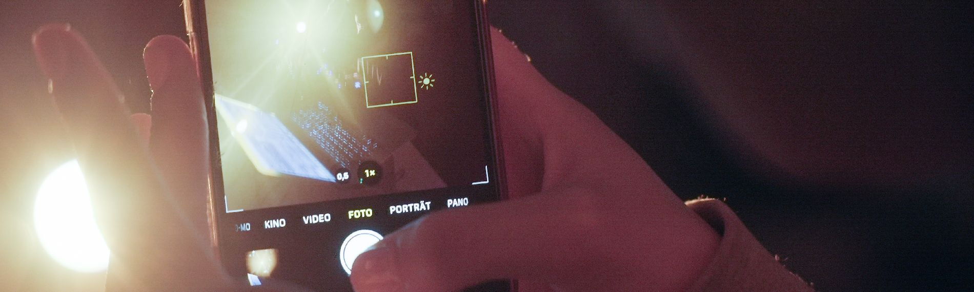 Person takes a picture with a smartphone