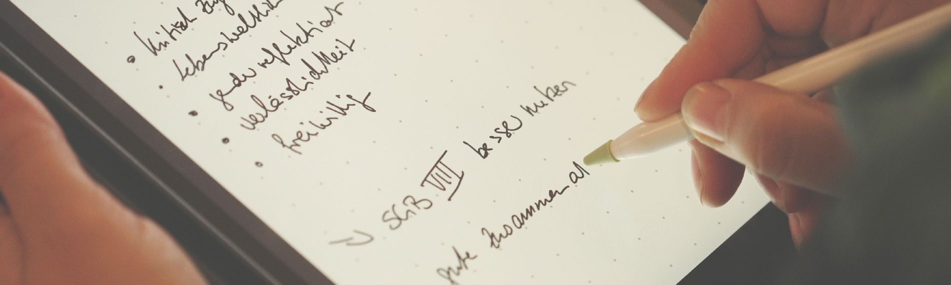 Person taking notes in a conference