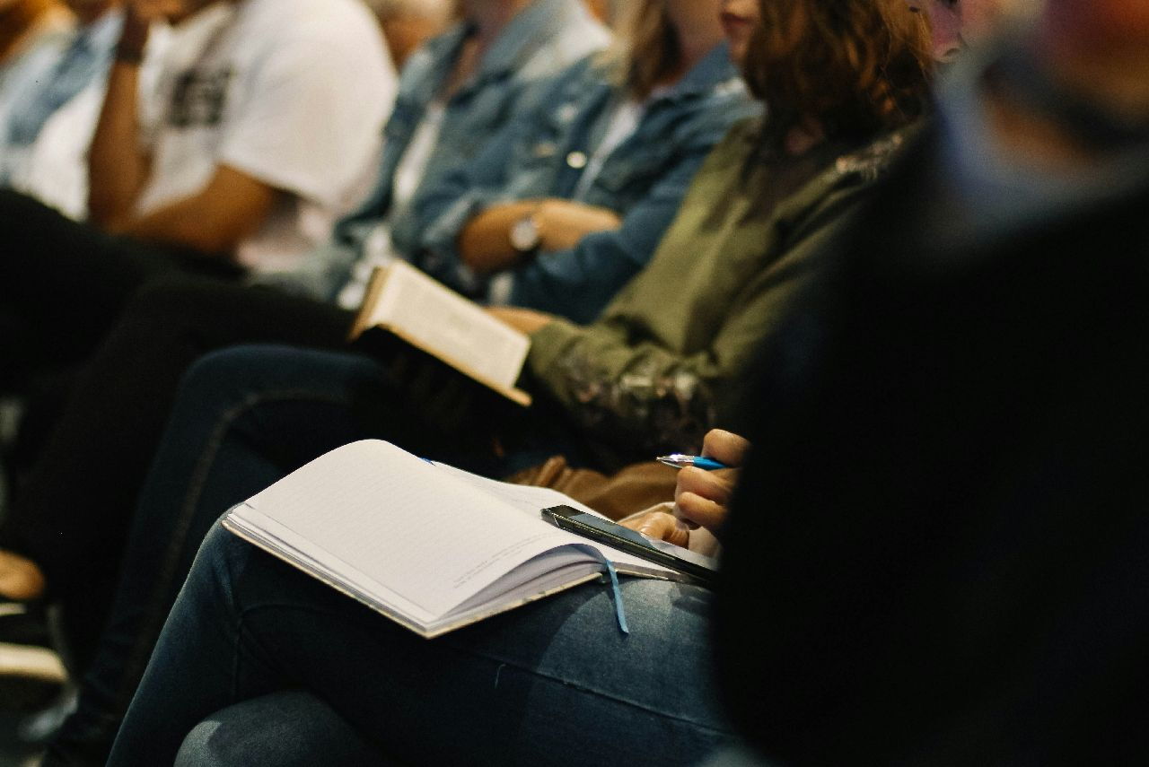 Conference audience listening to a presentation